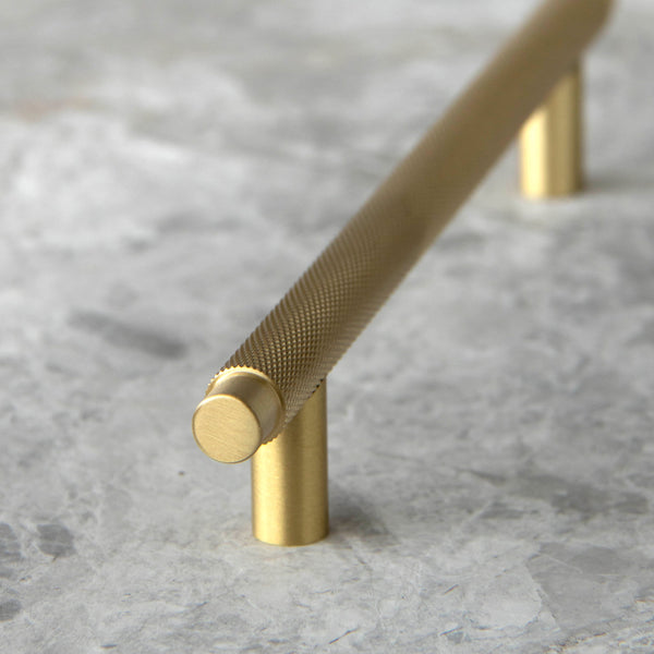 Frankie Handle in Satin Brass showing the Knurled detail.